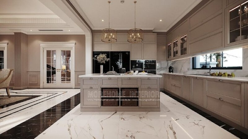 Bàn đảo bếp tân cổ điển ốp đá đẹp sang trọng với thiết kế nhiều hộc tủ cùng các ô mở giúp không gian trở nên linh động, tiện nghi. Mẫu bàn đảo bếp đá biệt thự