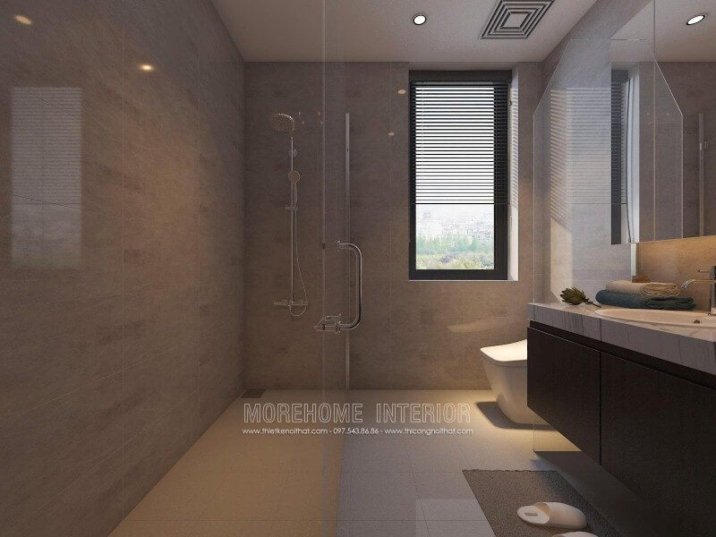 Phòng tắm nhỏ được trang bị đẹp và sang trọng với vách tắm kính 135 độ song song với các thiết bị như tủ, gương và bồn cầu.
